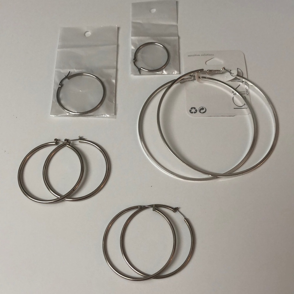 5 pairs of silver hoop earrings
